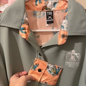 Retro green thunderbird with Orange Accents and cactus blossom accents